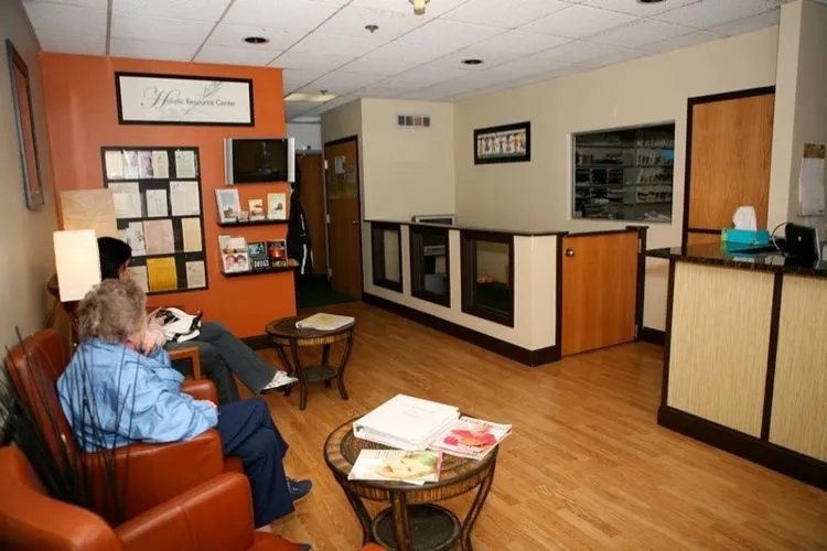 Reception and waiting area with warm wood floors