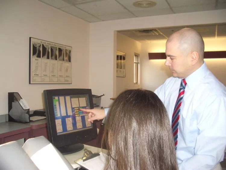 Doctor reviewing a patient's chart on the office computer